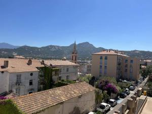 a view of a city with buildings and a church at Appartement Calvi, 3 pièces, 4 personnes - FR-1-63-339 in Calvi