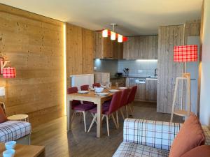 a kitchen and dining room with a table and chairs at Appartement Avoriaz, 3 pièces, 7 personnes - FR-1-634-92 in Morzine