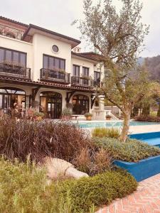 a house with a swimming pool in front of it at Casa XiX villa Venuestay in Vĩnh Phúc