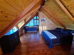 Postel nebo postele na pokoji v ubytování Cabaña en Los Reartes + 10 fotografií