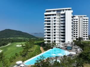 an aerial view of a resort with a swimming pool and a building at The Heaven Resort in Ansan