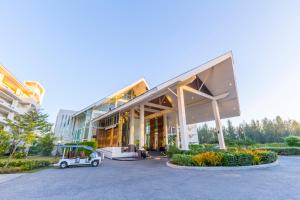 a golf cart parked in front of a building at Kantary Beach Hotel Villas & Suites in Khao Lak +62 photos