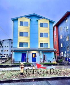 a yellow fire hydrant in front of a building at Apartment Studio with Shared Bathroom on 1st Floor in University District in Seattle