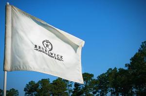 a white flag with a bmw maintenance center on it at Studio Home 1203L at Brunswick Plantation Resort and Golf Villas in the Heart of NC Seafood Country studio in Calabash