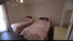a bedroom with two beds in a room at المهندسين خلف الاسواق الحره in Cairo