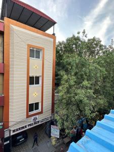 a building with stars painted on the side of it at MARINA PALACE in Chennai