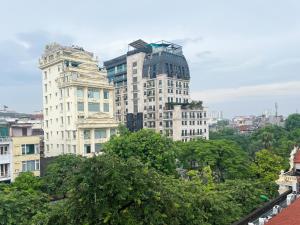 a group of tall buildings in a city at Joy Homestay in Hanoi