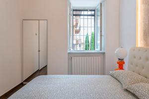 Postel nebo postele na pokoji v ubytování 4 Gnocchi - Galbiate