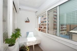 a balcony with a bench and a window at Katja Apartment in Zadar