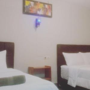 Ein Bett oder Betten in einem Zimmer der Unterkunft The Bloomy House