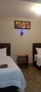 Ein Bett oder Betten in einem Zimmer der Unterkunft The Bloomy House