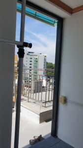 a view of a balcony with a pair of shoes at dakwan stay in Seoul