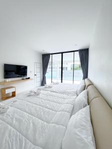 Una cama o camas en una habitación de Double P Pool Villa Hua Hin