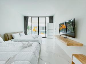 Una cama o camas en una habitación de Double P Pool Villa Hua Hin 34 fotos más