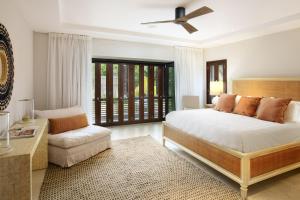 a bedroom with a large bed and a couch at Portico 3 by Blue Sky Luxury in Saint James