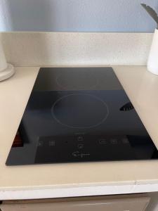 a microwave oven sitting on top of a counter at Rejuvenation Cottage - Wine Country Tranquility in Temecula