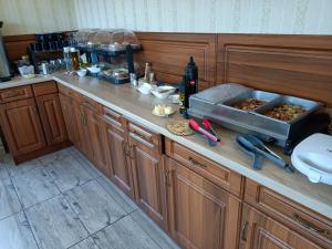 a kitchen with a counter with food on it at uDany Noclegi obok Gondoli in Szczyrk