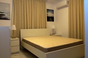 a bedroom with a bed in a room at Musan Boutique Apartments in Ayia Napa
