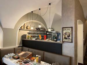 a dining room with a table and a bar at Hotel U Dvou medvídků in Chomutov +18 photos