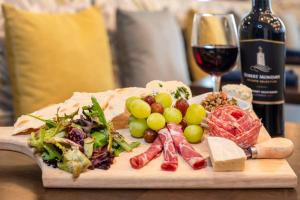 a plate of food and a glass of wine at Hotel Indigo - Panama City Marina, an IHG Hotel in Panama City