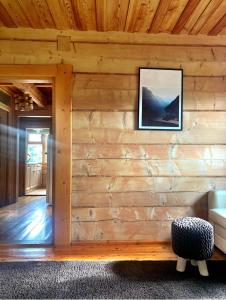a room with a wooden wall with a picture on it at Mountain cozy house in Tatras in Ząb