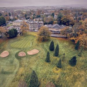 an aerial view of a golf course with three putting greens at Shaw Hill Hotel Golf And Country Club in Chorley