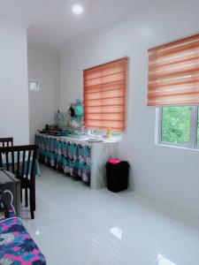 a room with a counter and a sink in a room at CozyL Homestay in 3 minutes drive to Redang Jetty in Kampong Ru Sepuloh