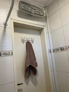 a towel hanging on a door in a bathroom at Vila Vera Novosadska 15 in Velika Remeta +82 photos