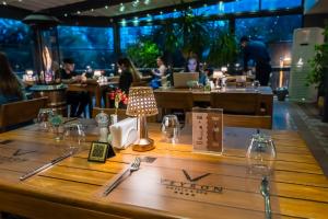 a table in a restaurant with a lamp on it at Veyron Hotels & SPA in Istanbul