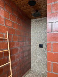 a brick wall with a wooden ceiling and a ladder at rodune in Koksijde +17 photos