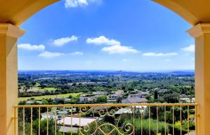 a view of a city from a balcony at Golf & Sea Residence Is Molas in Pula