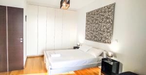 Кровать или кровати в номере Avatonblue Villa Nafplio