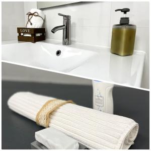 a white sink with a soap dispenser and a towel at Apartamento en Ametlla de Mar SEA VIEW HAUS FREE WIFI in L'Ametlla de Mar