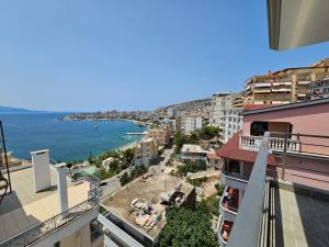 vistas al océano desde el balcón de un edificio en Vista View Sunshine apartment, en Sarandë