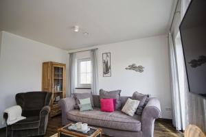 Posezení v ubytování Haus in idyllischer Lage mit Sauna, Terrasse und Garten - Villa Morgensünn
