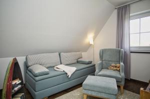 Posezení v ubytování Haus in idyllischer Lage mit Sauna, Terrasse und Garten - Villa Morgensünn