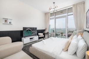 Postel nebo postele na pokoji v ubytování Executive Studio in Damac Hills by Suiteable + 37 fotografií