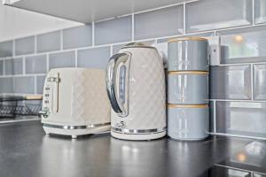 three toasters sitting on a counter in a kitchen at Homely/Stylish 1 Bed* 3 Guests in Southampton