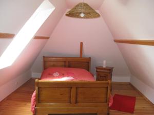 Ένα ή περισσότερα κρεβάτια σε δωμάτιο στο Gite De La Balle De Golf