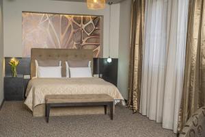Postel nebo postele na pokoji v ubytování Akacija Luxury Suites