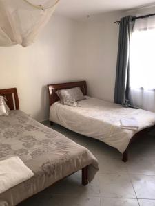 Ένα ή περισσότερα κρεβάτια σε δωμάτιο στο Neema Nyayo Embakasi
