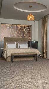 Postel nebo postele na pokoji v ubytování Akacija Luxury Suites
