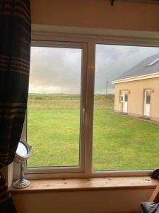a window with a view of a field of grass at Shanadune in Tralee