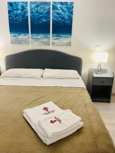 Postel nebo postele na pokoji v ubytování Tiburtina Suites, Roma