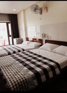 Postel nebo postele na pokoji v ubytování Căn hộ Tường Mơ (An Tâm Hotel)