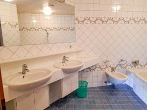 A bathroom at Holiday Home Ragusa by Interhome