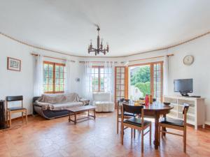 a living room with a couch and a table at Apartment La Caterina-1 by Interhome in Saint-Cyr-sur-Mer