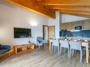 a kitchen and dining room with a table and chairs at Apartment T-Resort La Tzoumaz 4p8 vue vallée by Interhome in La Tzoumaz +33 photos