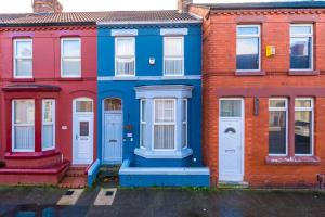 a row of colorful houses in a street at Finchley House by Anfield in Liverpool
