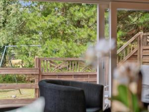 a view of a deck from a porch with chairs at Holiday Home Hillmari - 650m from the sea in Bornholm by Interhome in Vester Sømarken